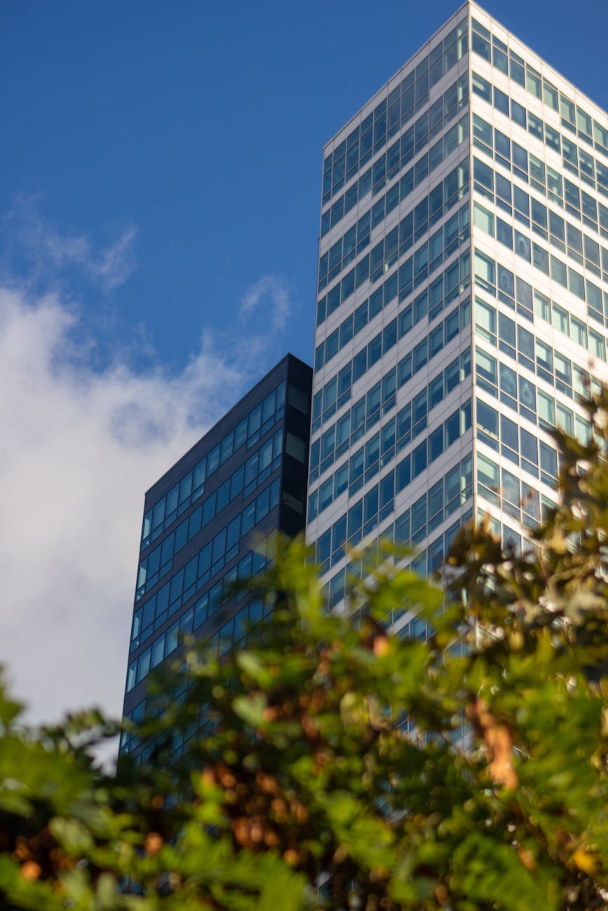 Stunning low-angle view of modern skyscrapers against a vibrant blue sky in Istanbul.